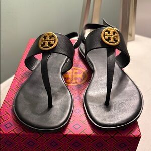 Tory Burch Black and Gold Sandals with Logo Medallion